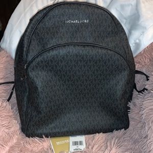 Large black and gray Michael Kors Abbey Backpack.